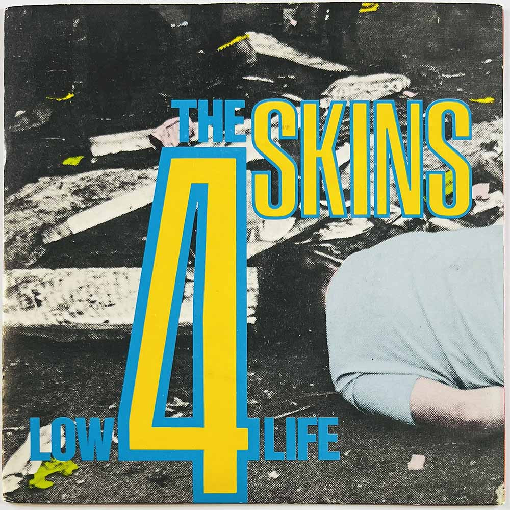 4 Skins käytetty 7” kuvakannella Low Life / Bread Or Blood  kansi VG+ levy EX käytetty vinyylisingle PS