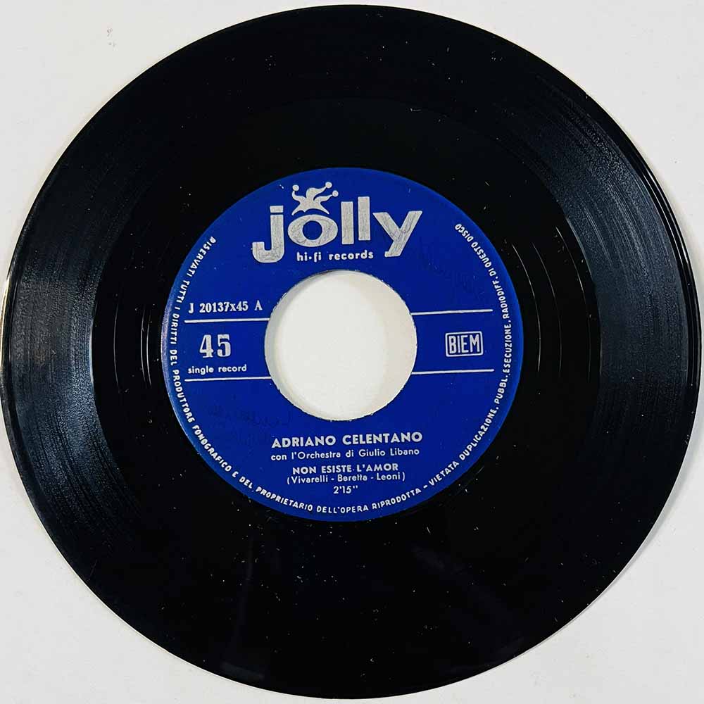 Celentano Adriano Käytetty 7” ei kuvakantta Non Esiste L'Amor / Basta  kansi Ei kuvakantta levy VG käytetty vinyylisingle