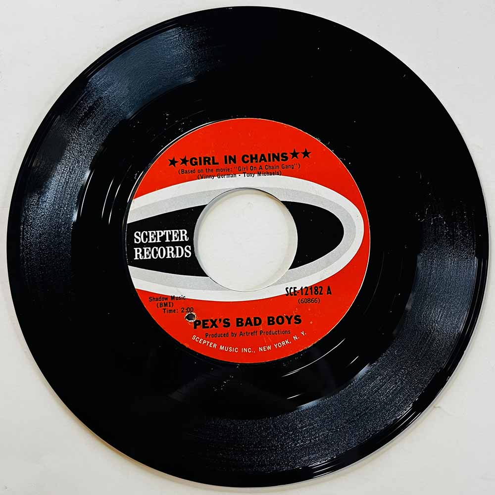 Peck's Bad Boys Käytetty 7” ei kuvakantta Girl In Chains / Silver Dawn  kansi Ei kuvakantta levy EX käytetty vinyylisingle