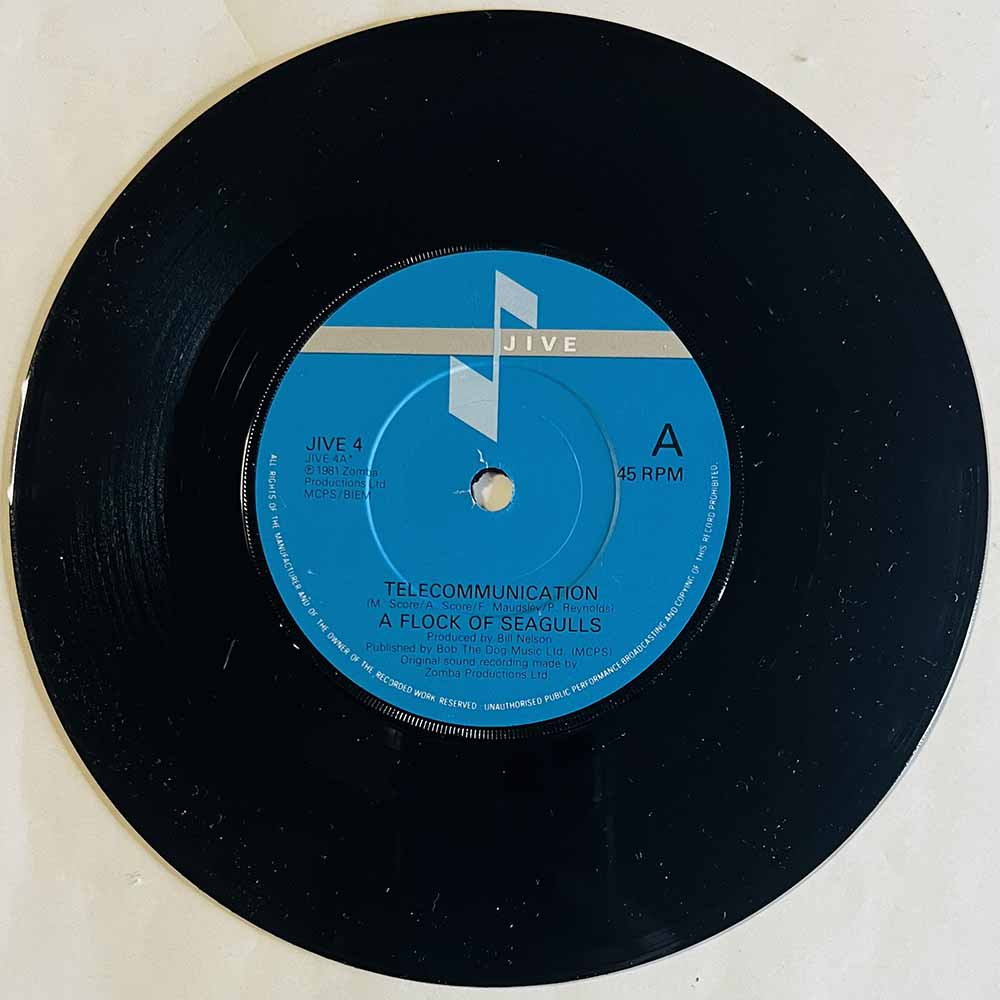 Flock Of Seagulls Käytetty 7” ei kuvakantta Telecommunication  kansi Ei kuvakantta levy ex- käytetty vinyylisingle