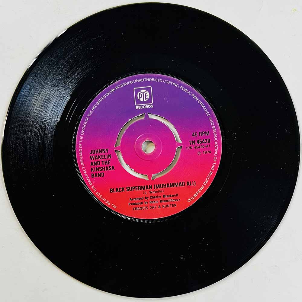 Johnny Wakelin And The Kinshasa Band Käytetty 7” ei kuvakantta Black Superman (Muhammad Ali) / Bang the drum  kansi Ei kuvakantt
