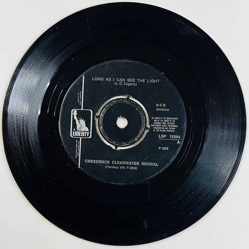 Creedence Clearwater Revival Käytetty 7” ei kuvakantta Long as I can see the light  kansi Ei kuvakantta levy VG- käytetty vinyyl