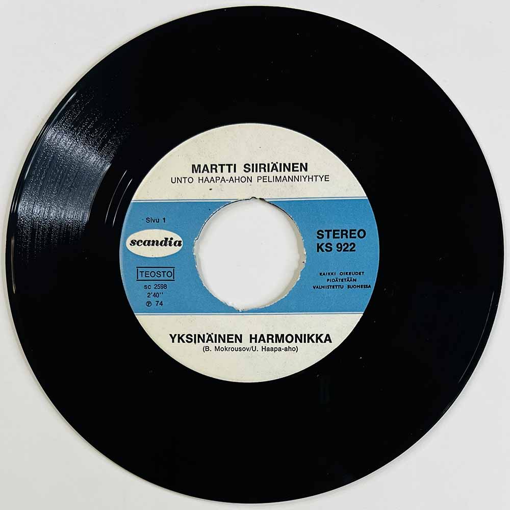 Siiriäinen Martti Käytetty 7” ei kuvakantta Yksinäinen Harmonikka / Ajomies  kansi Ei kuvakantta levy EX- käytetty vinyylisingle