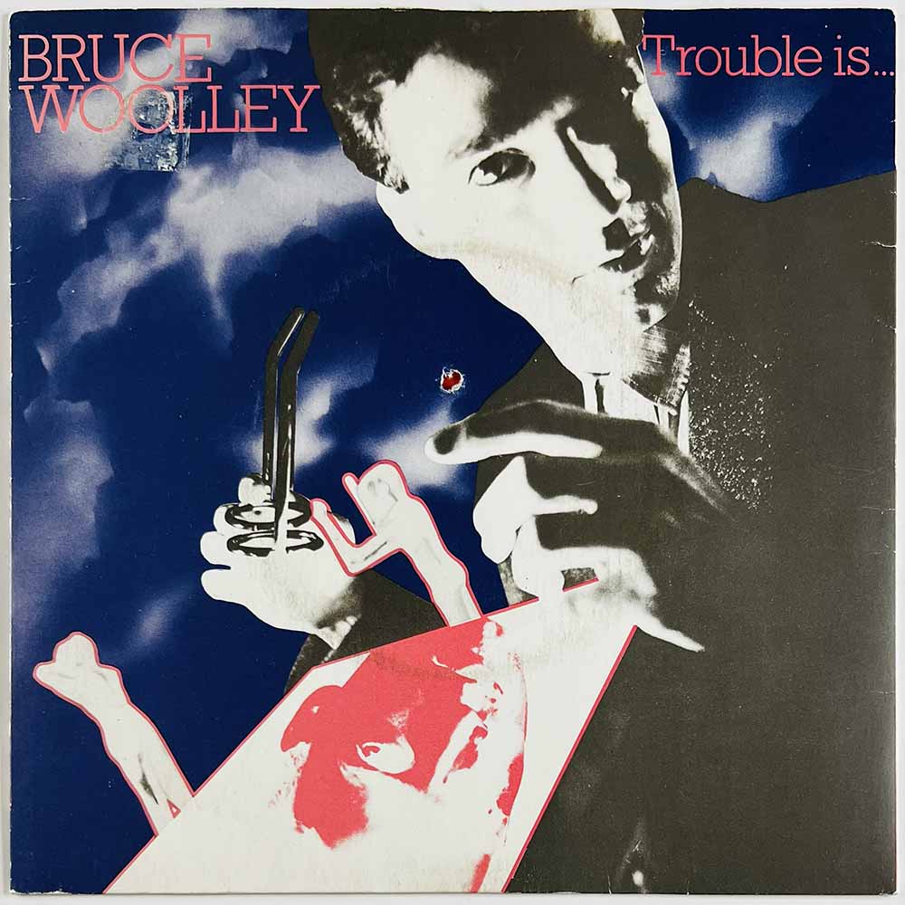 Bruce Woolley vinyylisingle Trouble Is...  kansi EX levy EX käytetty vinyylisingle PS