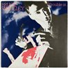 Bruce Woolley vinyylisingle Trouble Is...  kansi EX levy EX käytetty vinyylisingle PS