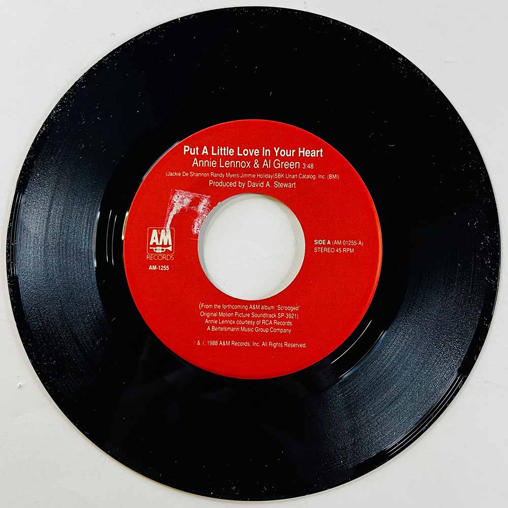 Annie Lennox & Al Green Käytetty 7” ei kuvakantta Put A Little Love In Your Heart  kansi Ei kuvakantta levy EX käytetty vinyylis