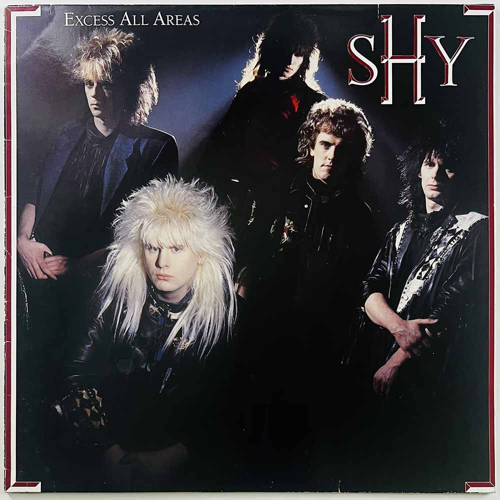 Shy LP Excess all areas  kansi VG+ levy EX Käytetty LP