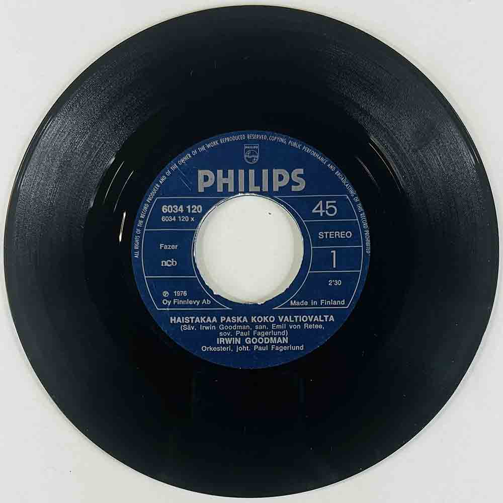 Irwin Goodman Käytetty 7” ei kuvakantta Haistakaa paska koko valtiovalta / pumtsi-kaada-pum-pum  kansi Ei kuvakantta levy VG+ vi